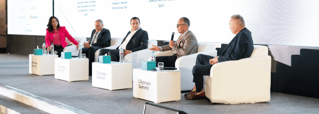 Speakers on stage at a Cityscape Conference