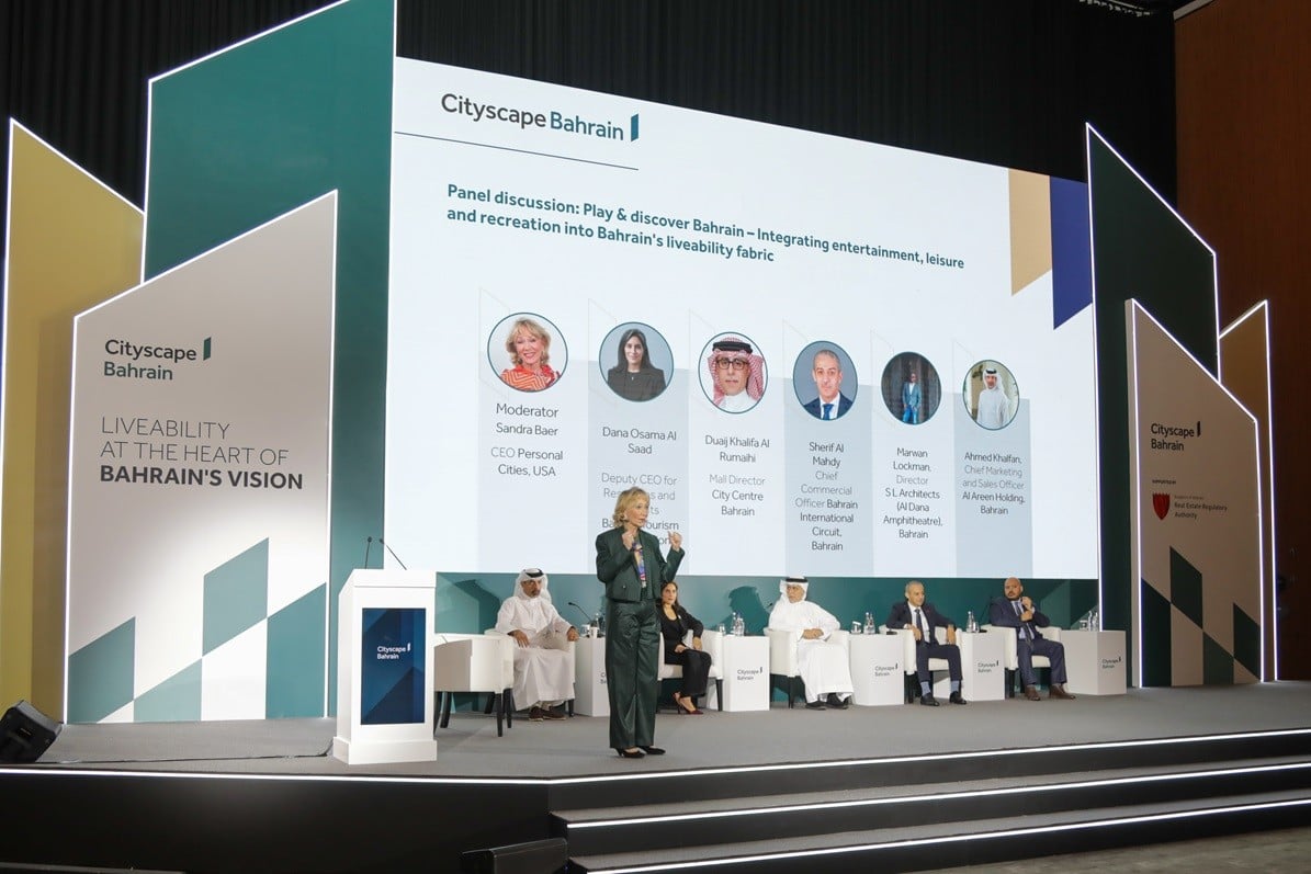 Keynote speaker with panellists at conference